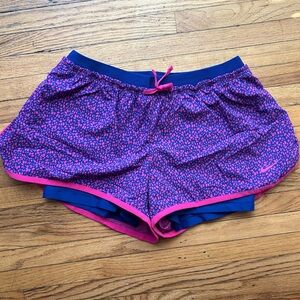 Nike Women's Navy Blue Running Shorts with Pink Accents
